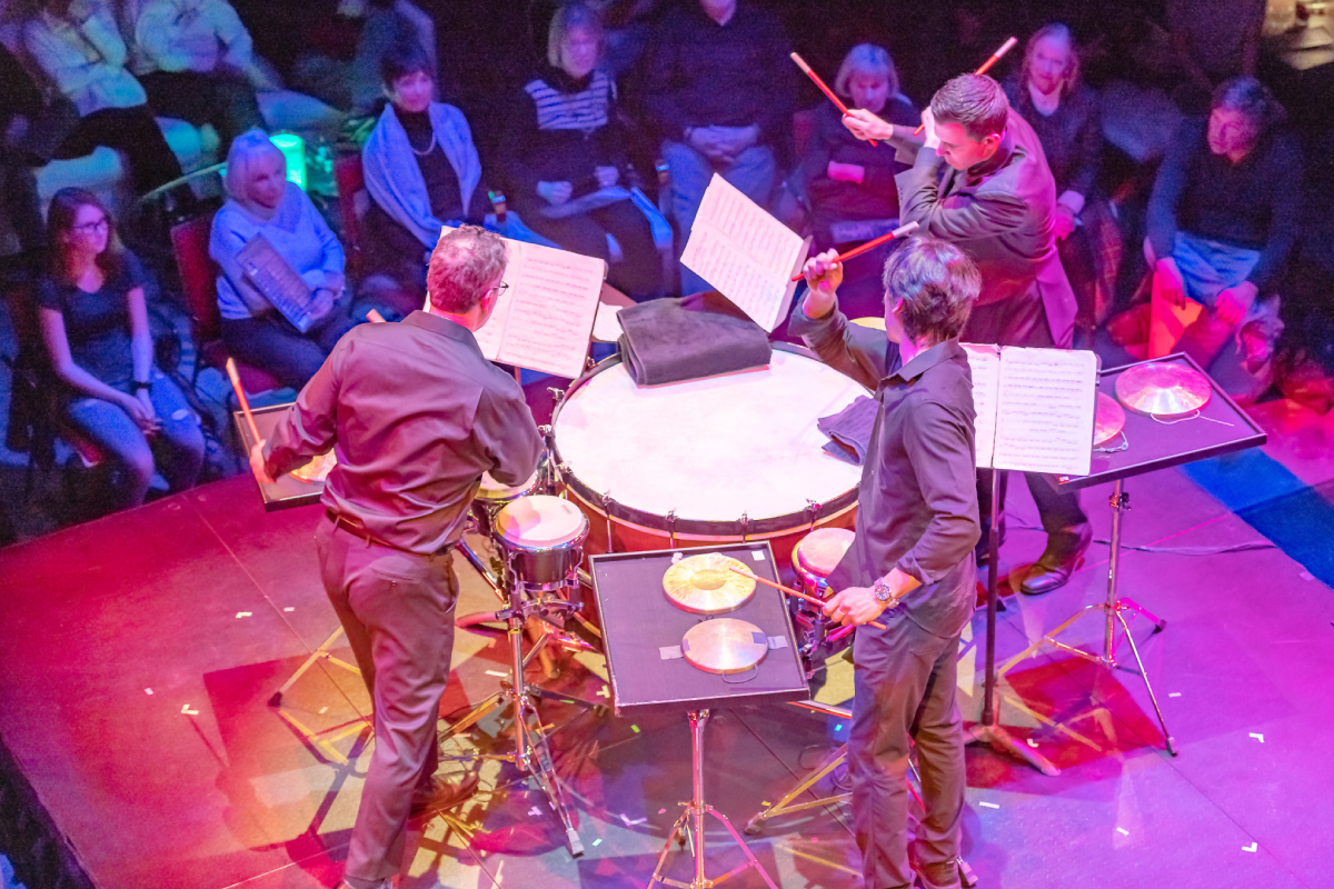 Drum trio performing