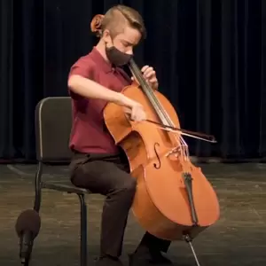 Student cellist performing